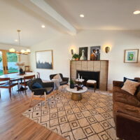 Living room with vaulted ceilings and fireplace