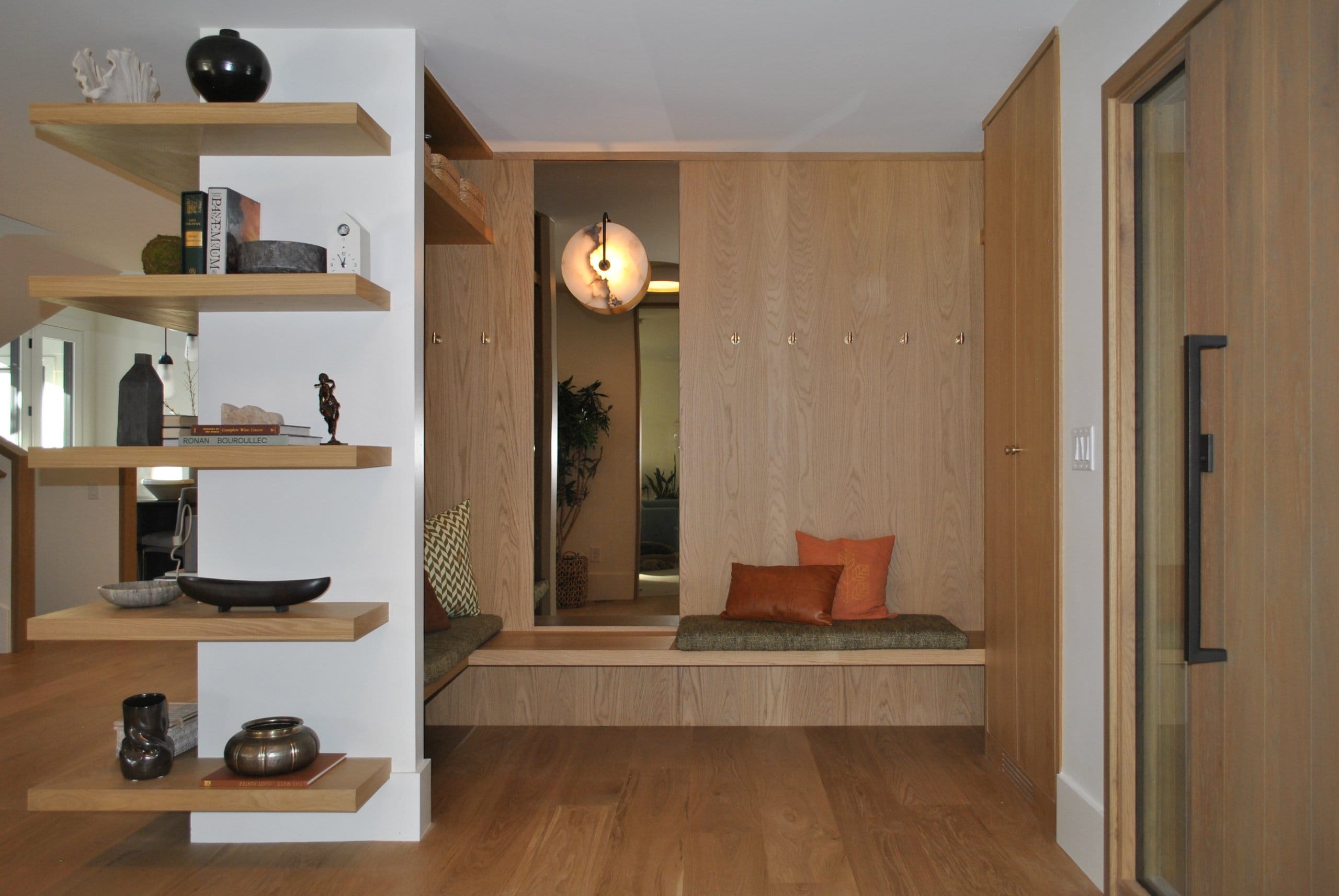 Built-in storage and seating near the entrance of the home.