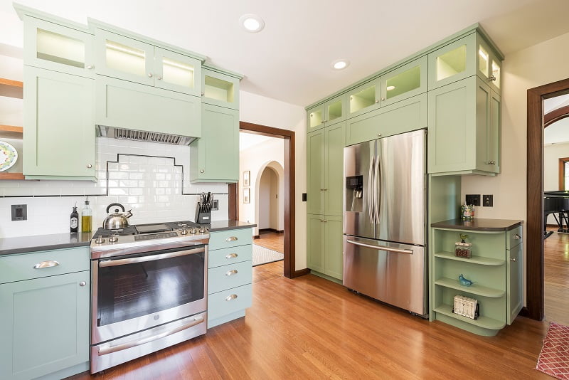 Arches, Arch ways, Kitchen Remodels, Colorful cabinets, mint green cabinets, Tudor Kitchen | Renovation Design Group