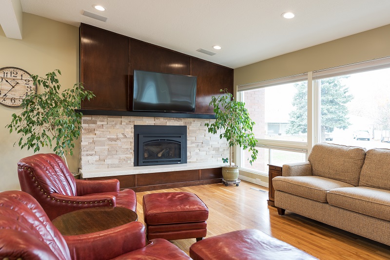 After remodeling the Interior Living Room with Modern Fireplace in a MidCentury Home