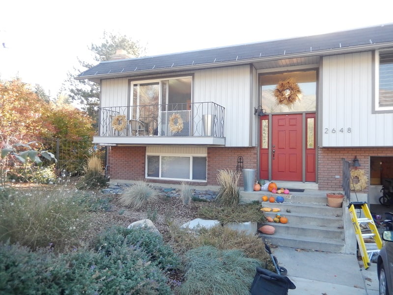 The Before exterior remodel of a split Level Home