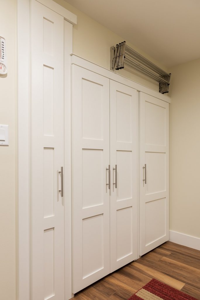 After Interior Storage Laundry Room Basement Apartment remodel | Renovation Design Group
