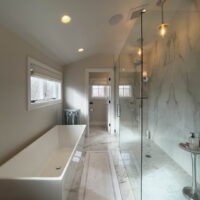 Primary suite with bathtub and large shower
