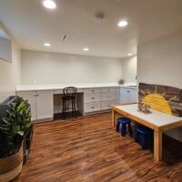 Thumbnail of http://Custom%20basement%20craft%20room%20with%20built-in%20desks%20and%20storage.