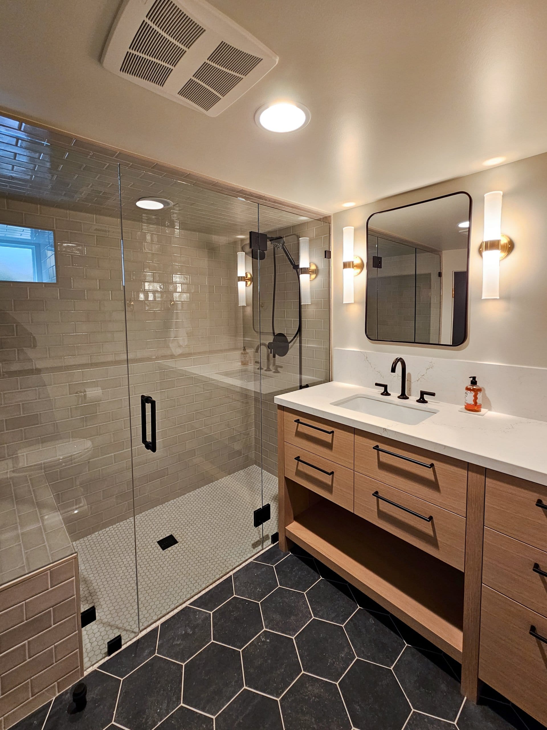 Modern bathroom vanity and shower.