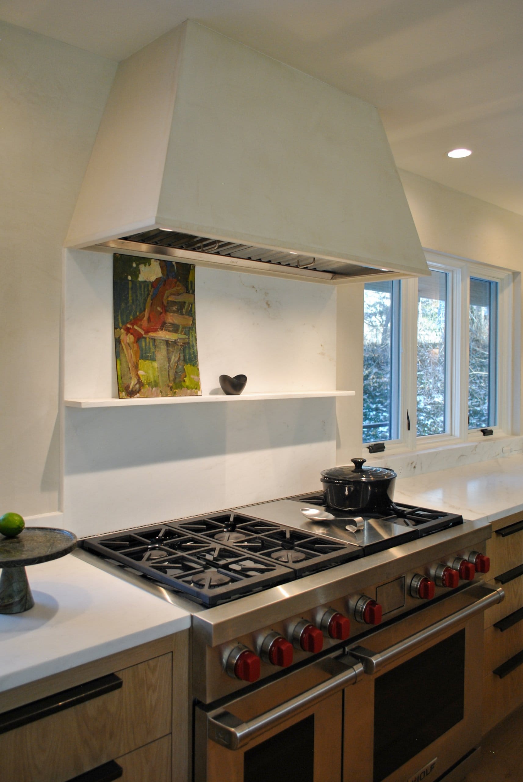 Large kitchen range with a small shelf behind.