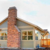 Exterior Home Remodel brick Chimney on Cottage home | Renovation Design Group