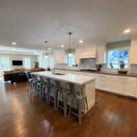 Thumbnail of http://Large%20and%20open%20concept%20kitchen%20that%20includes%20double%20ovens,%20an%20island%20with%20seating%20for%20seven%20and%20a%20sink,%20and%20lots%20of%20storage.