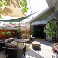 Thumbnail of http://Outdoor%20Patio,%20Sun%20Shading,%20Tension,%20indoor%20outdoor%20space%20cable%20railing%20open%20stair%20contemporary%20vaulted%20ceiling,%20fireplace,%20living%20space%20contemporary%20vaulted%20ceiling,%20fireplace,%20living%20space%20kitchen%20island,%20bar%20stool,%20contemporary%20kitchen,%20lighting%20skylights%20and%20window%20natural%20light,%20glass%20table,%20rug%20Murphy%20Bed%20contemporary%20bed,%20casework,%20galvanized%20ceiling%20|%20Renovation%20Design%20Group
