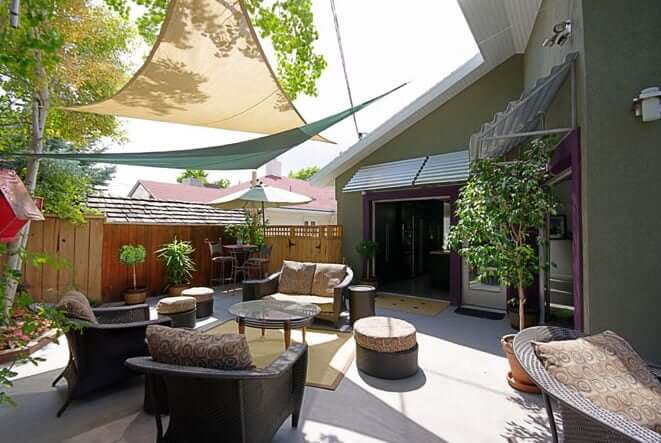 Outdoor Patio, Sun Shading, Tension, indoor outdoor space cable railing open stair contemporary vaulted ceiling, fireplace, living space contemporary vaulted ceiling, fireplace, living space kitchen island, bar stool, contemporary kitchen, lighting skylights and window natural light, glass table, rug Murphy Bed contemporary bed, casework, galvanized ceiling | Renovation Design Group