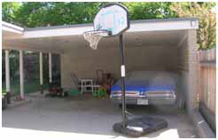 1800 East Cape Exterior Before Garage | Renovation Design Group