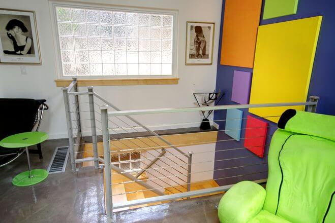 cable railing open stair contemporary vaulted ceiling, fireplace, living space contemporary vaulted ceiling, fireplace, living space kitchen island, bar stool, contemporary kitchen, lighting skylights and window natural light, glass table, rug Murphy Bed contemporary bed, casework, galvanized ceiling | Renovation Design Group