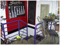 Before cable railing open staircable railing open stair contemporary vaulted ceiling, fireplace, living space contemporary vaulted ceiling, fireplace, living space kitchen island, bar stool, contemporary kitchen, lighting skylights and window natural light, glass table, rug Murphy Bed contemporary bed, casework, galvanized ceiling | Renovation Design Group