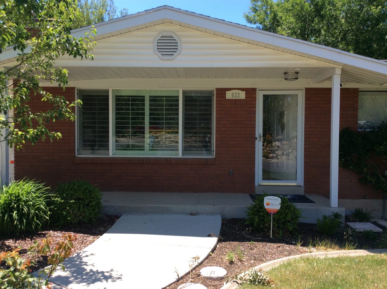 Before exterior Oakleaf Ranch home | Renovation Design Group