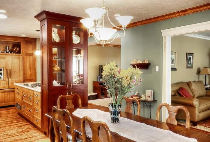 Great Room Renovation dark wood with bar stools, dining area and open floor plan | Renovation Design Group