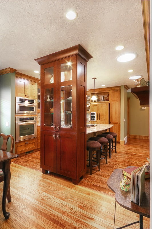 Great Room Renovation dark wood with bar stools, dining area and open floor plan | Renovation Design Group