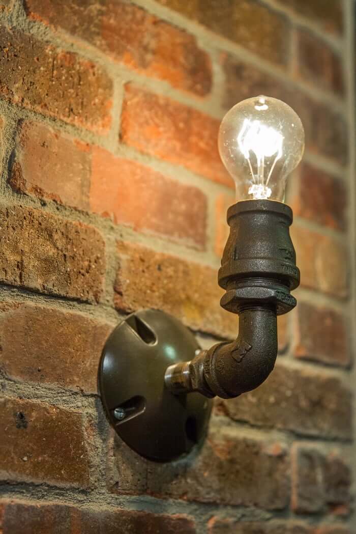 After Interior Remodels_Bathroom Brick_Industrial Lighting | Renovation Design Group