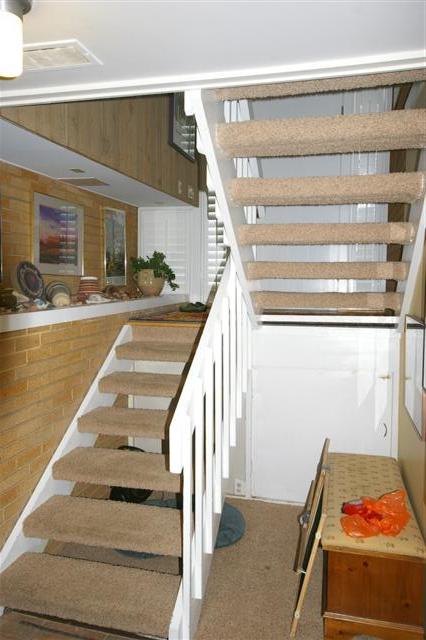 before image split level stairs After_Interior Remodel_Living Room_Family Room Design resized | Renovation Design Group