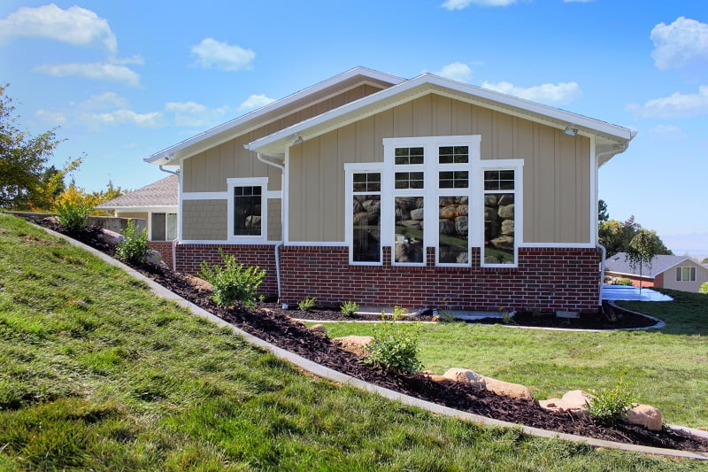 After Exterior Window Remodels new Windows Split Entry Home exterior | Renovation Design Group