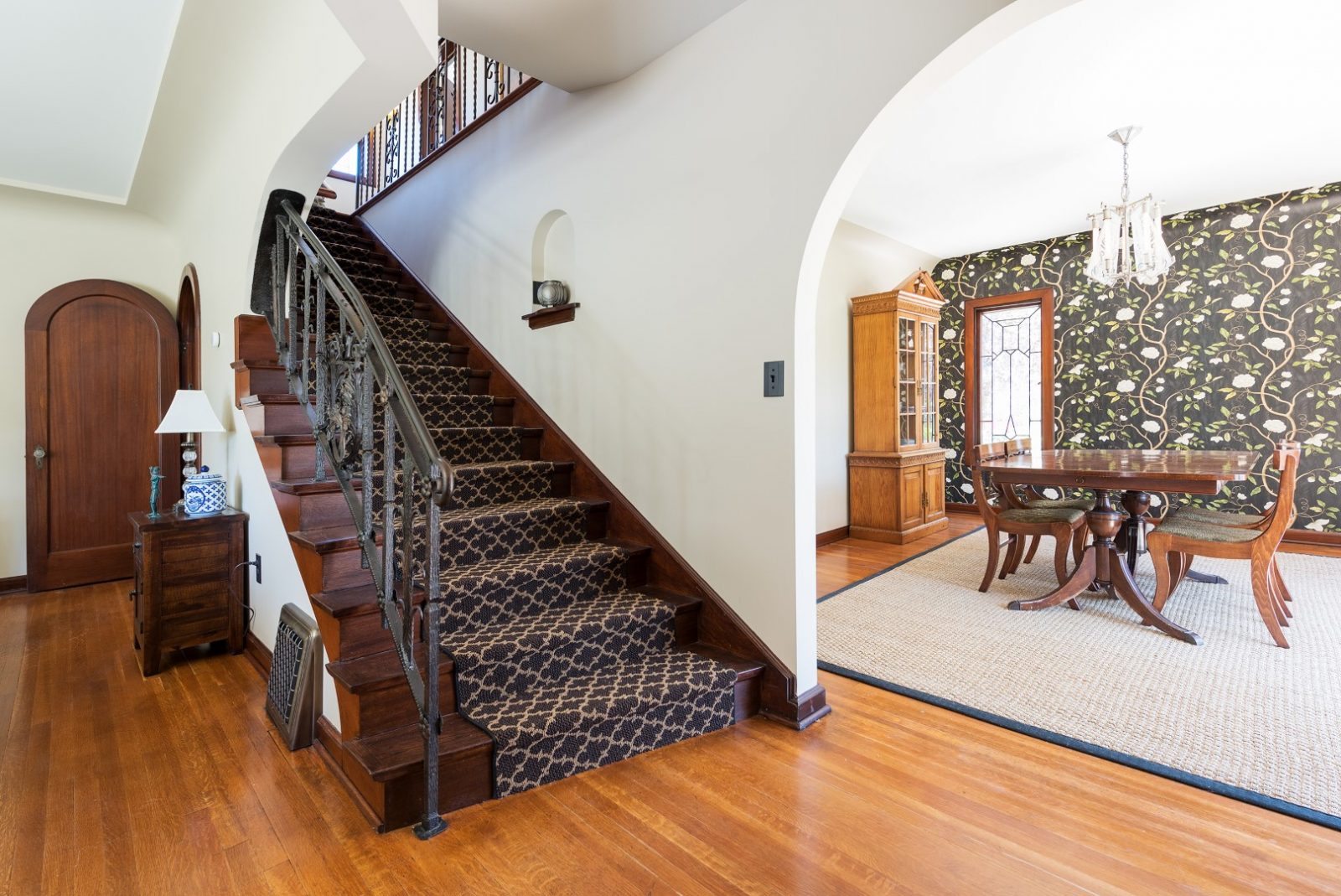 Staircase to second floor, Tudor, Entry Way, Full Stairs, Hard Wood, Bold Wallpaper | Renovation Design Group