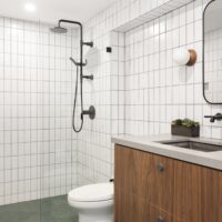 Thumbnail of http://Modern%20bathroom%20featuring%20a%20curbless%20shower,%20wood%20vanity%20with%20storage,%20and%20green%20tiles%20on%20the%20floor%20and%20white%20tiles%20on%20the%20wall.