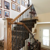 Stair case second story adition on Tudor home | Renovation Design Group