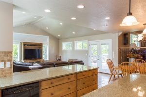 Sat Lake City Utah After remodeling the kitchen in a split level granite counter, custom cabinets, pendant lights, natural lighting | Renovation Design Group