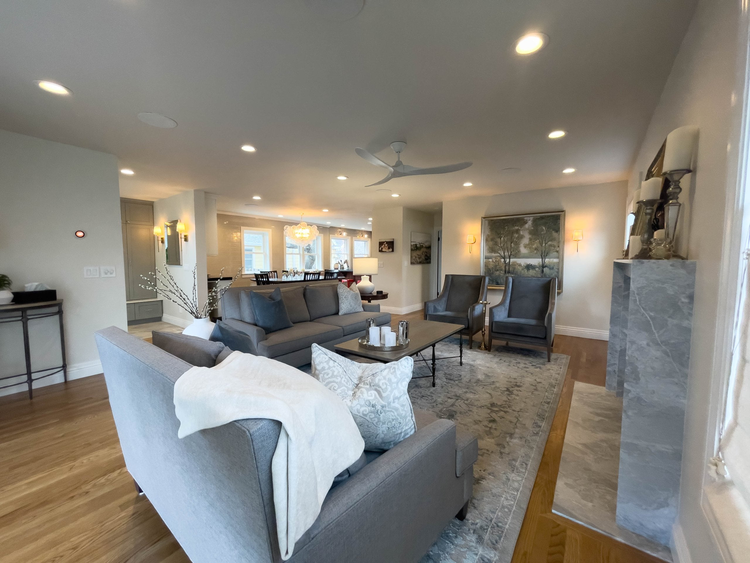 Open concept family room with furniture and clear sightlines to the dining room.