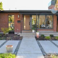 Thumbnail of http://Front%20porch%20of%20the%20home%20after%20the%20remodel%20with%20a%20mid-century%20modern%20design.