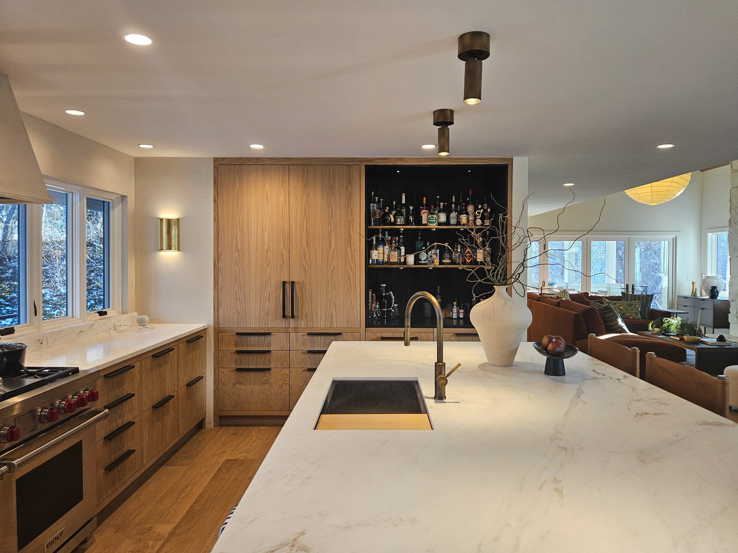 Kitchen with the sink in the island and a built-in bar.