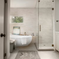 Thumbnail of http://Renovated%20primary%20bathroom%20with%20a%20large%20freestanding%20tub%20and%20shower.
