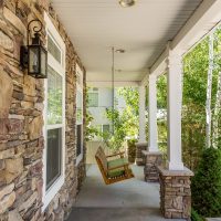 After_Exterior_Home Exterior Renovations_Large Porch_Traditional Porch remodels_Porch Swings | Renovation Design Group