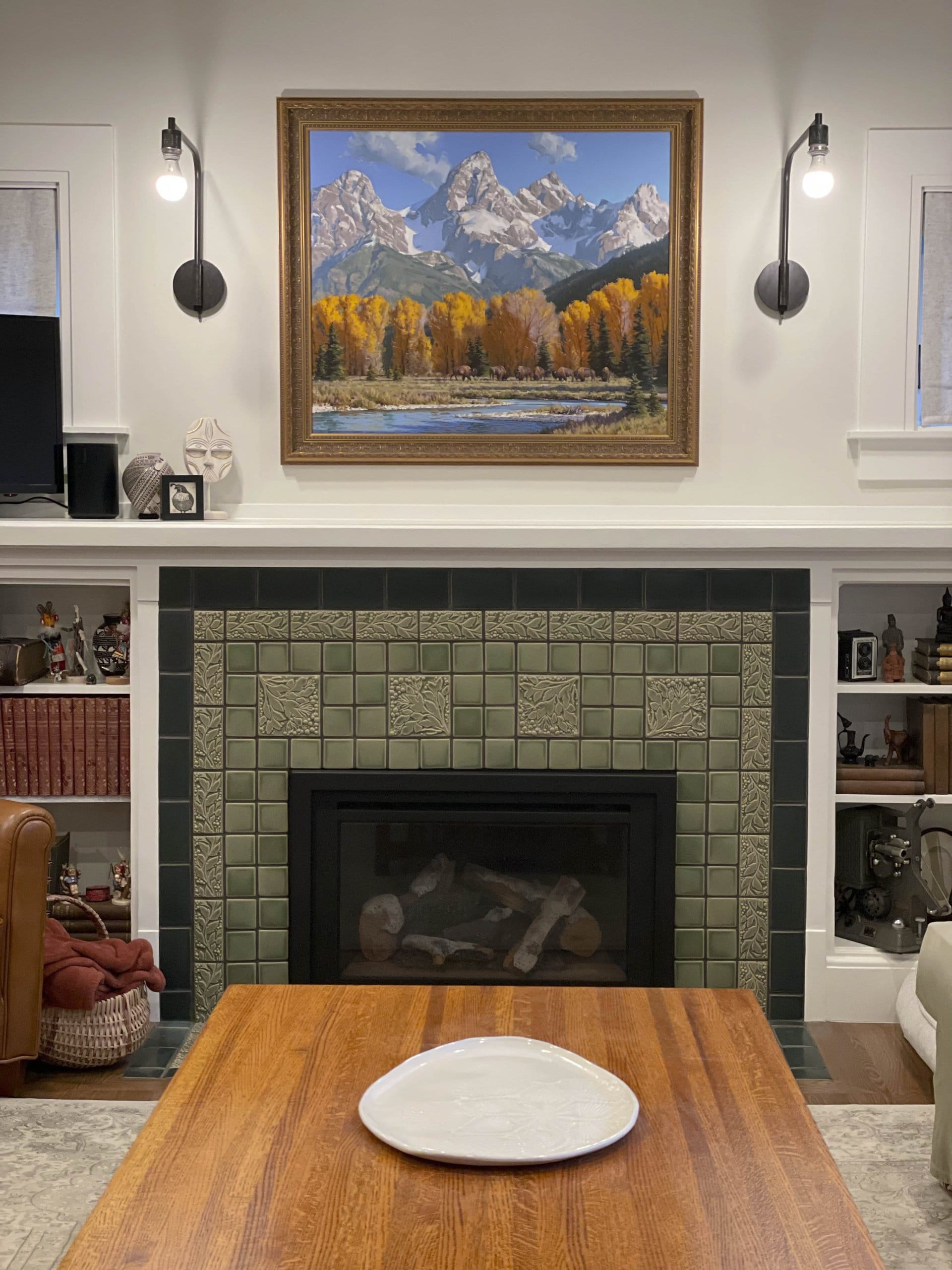 Living room fireplace with a picture above.