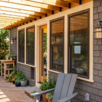 Thumbnail of http://Patio%20with%20a%20pergola%20above,%20seating,%20and%20lots%20of%20plants.