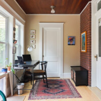 Thumbnail of http://Office%20area%20in%20the%20addition.%20A%20desk%20is%20located%20under%20the%20windows%20on%20the%20left,%20a%20door%20is%20straight%20ahead,%20and%20a%20bench%20and%20door%20are%20located%20to%20the%20right.