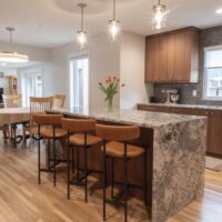 Updated kitchen with island and stools