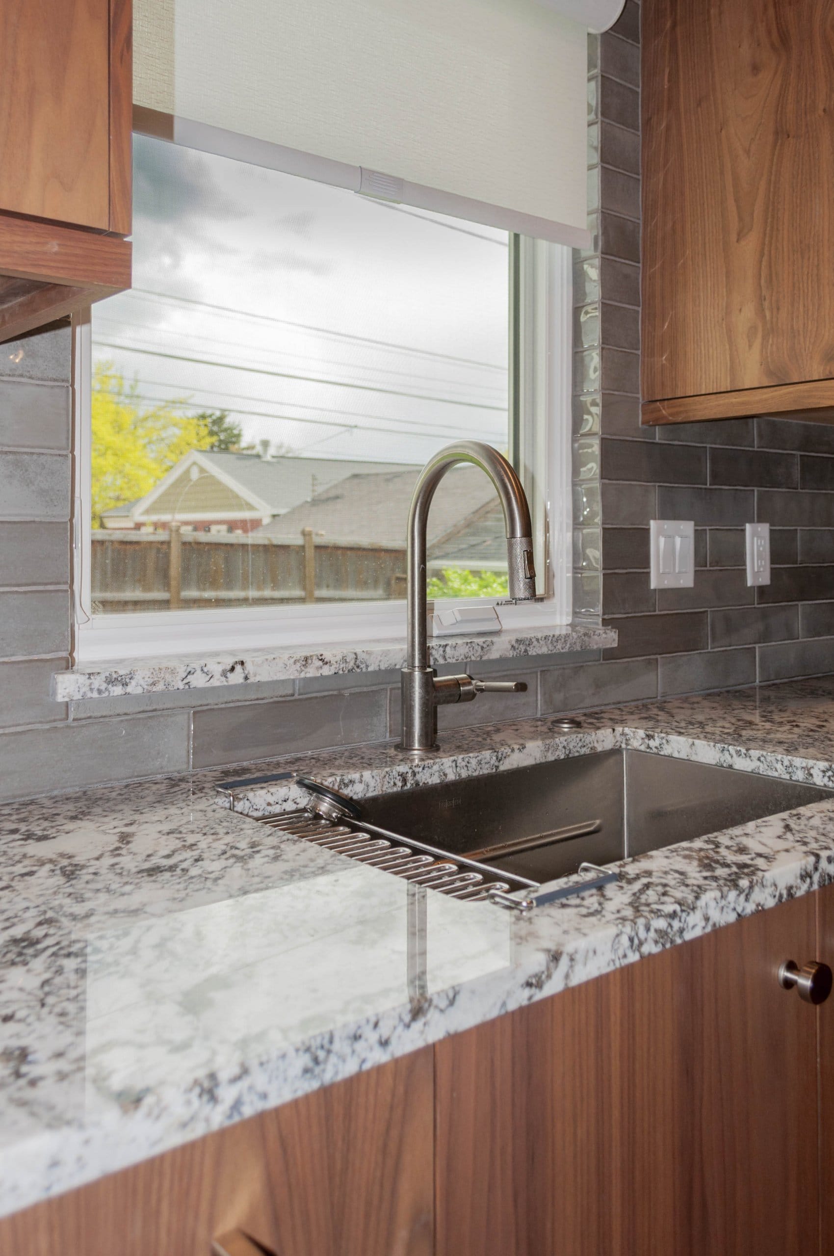 Updated kitchen sink with a window above.