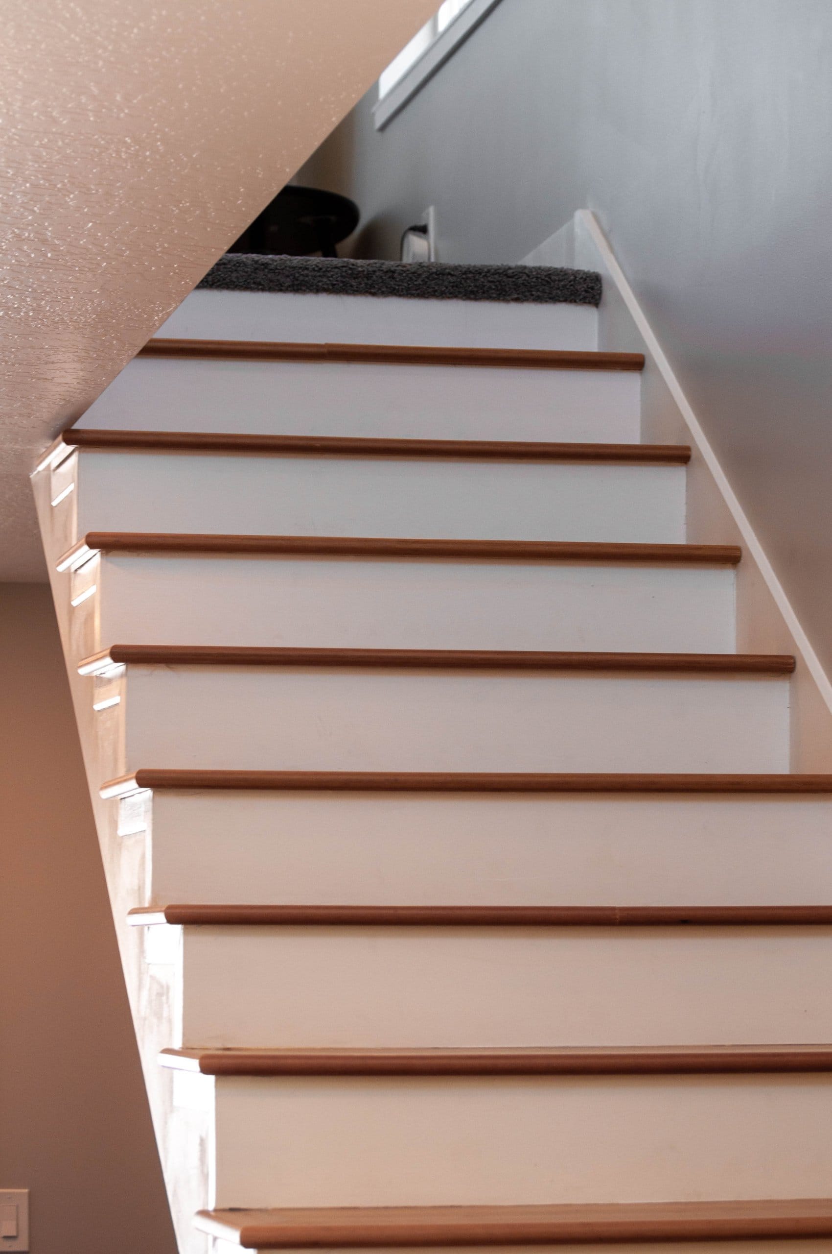 Open staircase with carpet at the top.