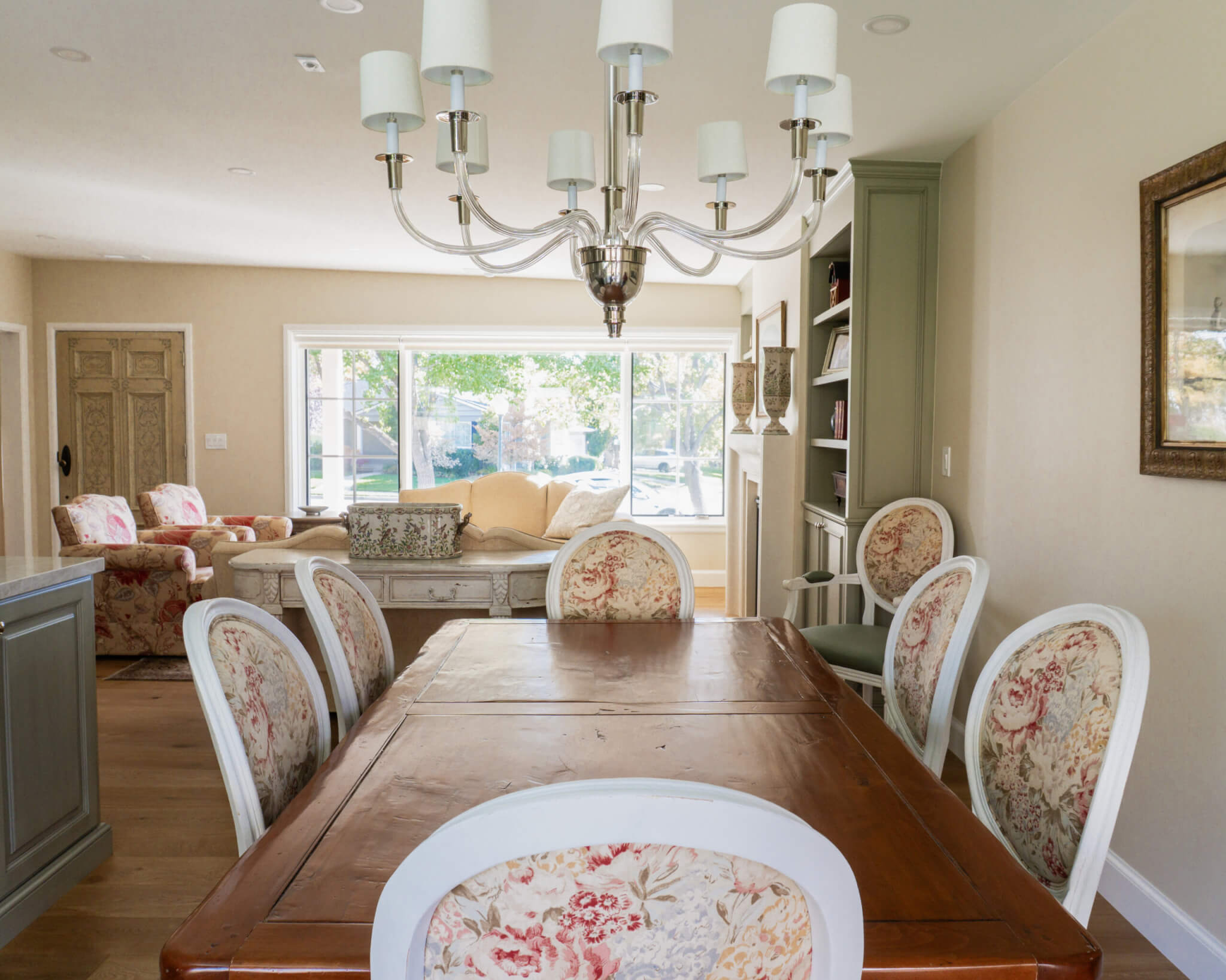 View from the dining room table toward the large window in the living room.