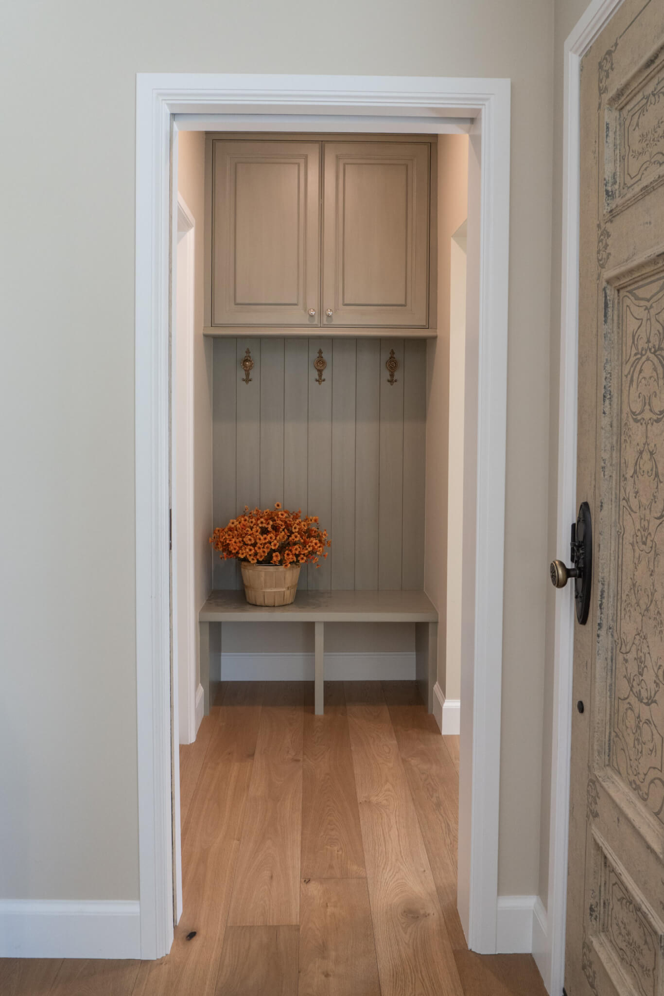 Small mudroom nook with built-in cabinets.