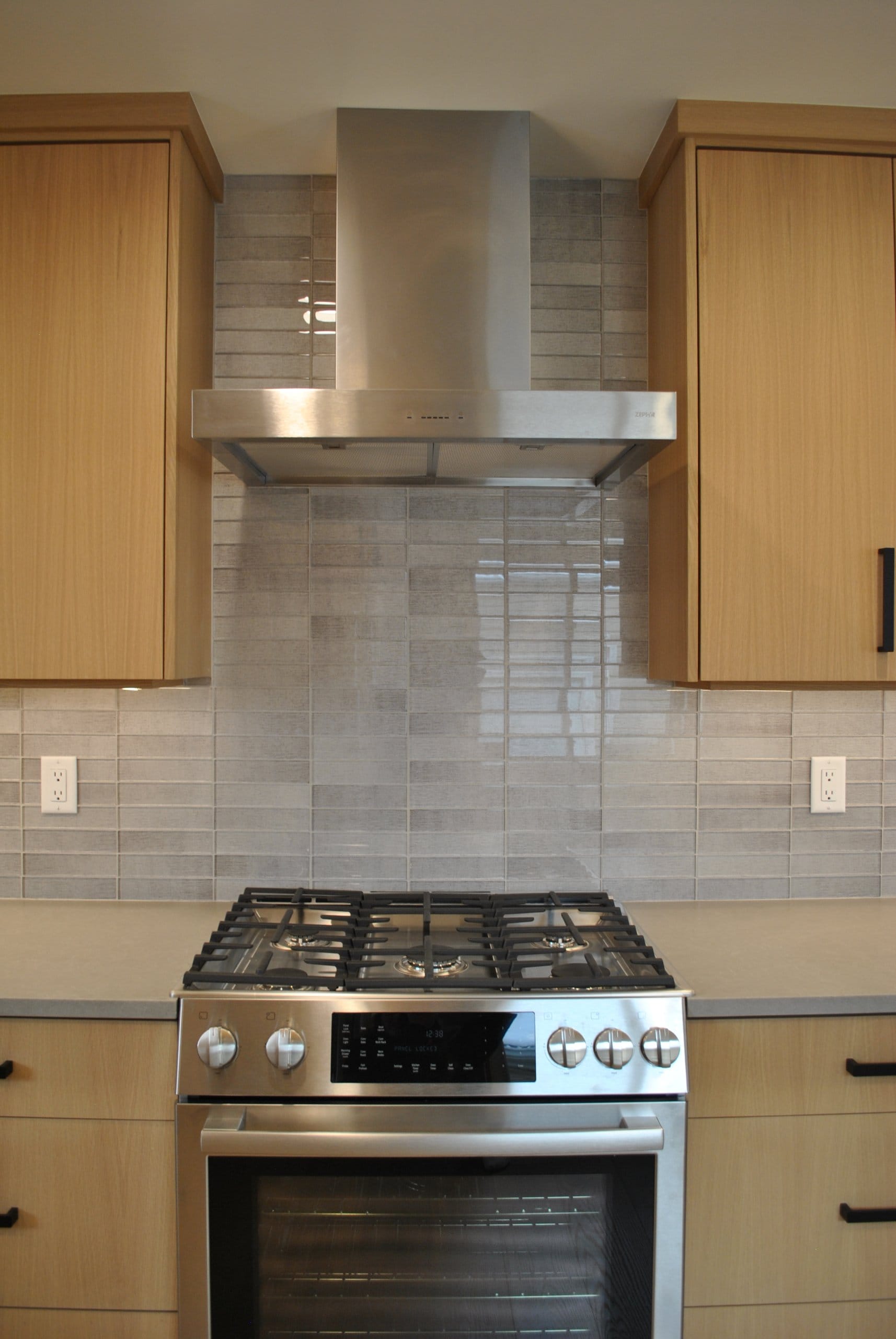 Kitchen stove with range hood.