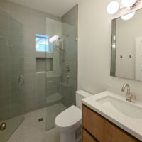 Thumbnail of http://Bathroom%20remodel%20with%20a%20shower,%20toilet,%20and%20one%20sink%20vanity.%20The%20shower%20includes%20a%20niche%20for%20soaps%20and%20a%20small%20window.