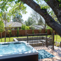 Thumbnail of http://Hot%20tub%20on%20a%20deck%20overlooking%20the%20backyard,