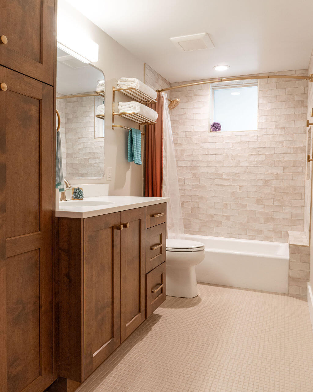 Large renovated guest bathroom with neutral finishes.