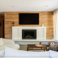 Thumbnail of http://Mid-century%20modern%20fireplace%20with%20wood%20paneling%20on%20the%20wall.