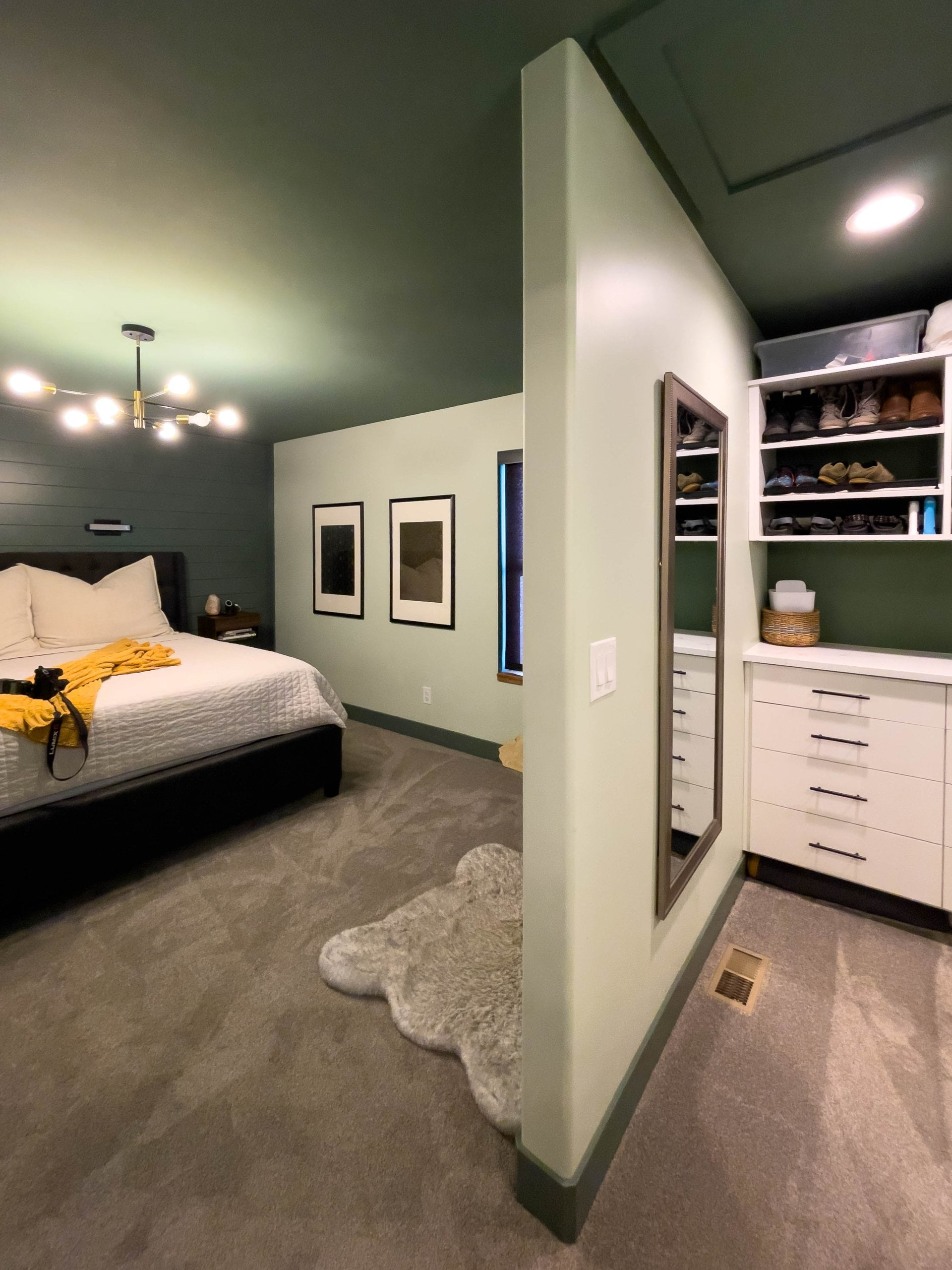 Primary closet and primary bedroom. Both rooms include carpet.