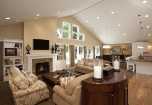 Large family room with vaulted ceilings and a fireplace | Renovation Design Group