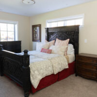Thumbnail of http://Primary%20bedroom%20with%20a%20bed,%20nightstand,%20and%20dresser.