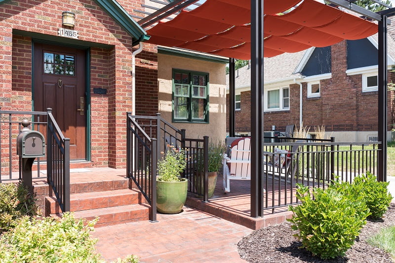 After, Exterior, front porch, pergolas, sun shades | Renovation Design Group