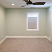 Thumbnail of http://Renovated%20primary%20bedroom%20with%20carpet,%20a%20ceiling%20fan,%20and%20a%20window.%20On%20the%20right%20is%20a%20pocket%20door%20with%20access%20to%20the%20primary%20bathroom.